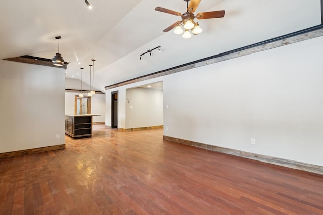 unfurnished living room with lofted ceiling, hardwood / wood-style flooring, and ceiling fan