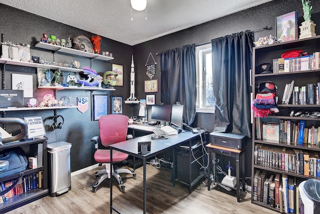 office area featuring hardwood / wood-style flooring and a textured ceiling