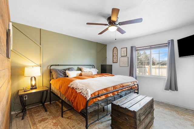 bedroom featuring ceiling fan and light wood-type flooring