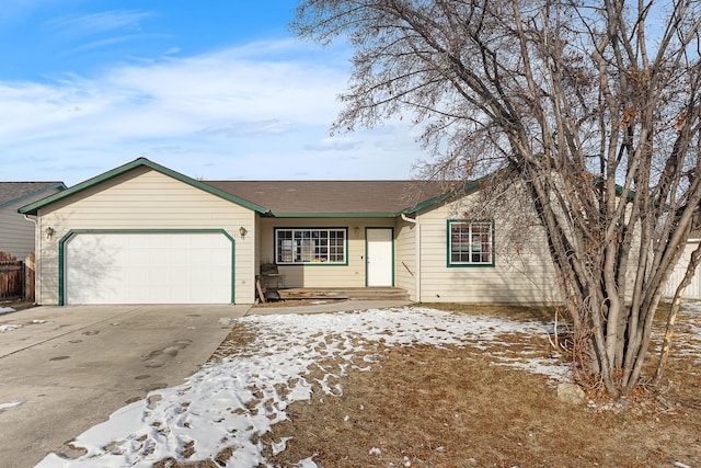 ranch-style home featuring a garage