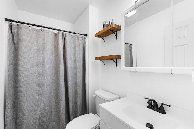 full bathroom with vanity and toilet