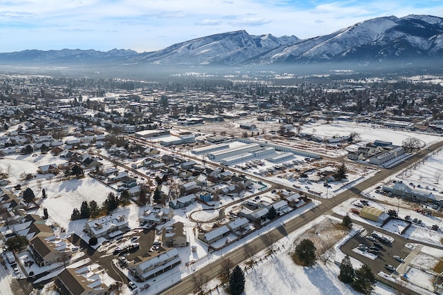 snowy aerial view with a mountain view