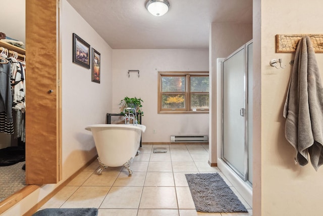 bathroom with a baseboard heating unit, tile patterned floors, and shower with separate bathtub