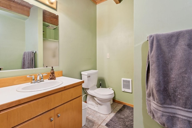 bathroom with vanity, tile patterned floors, and toilet