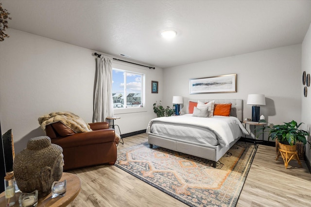 bedroom with light wood-type flooring