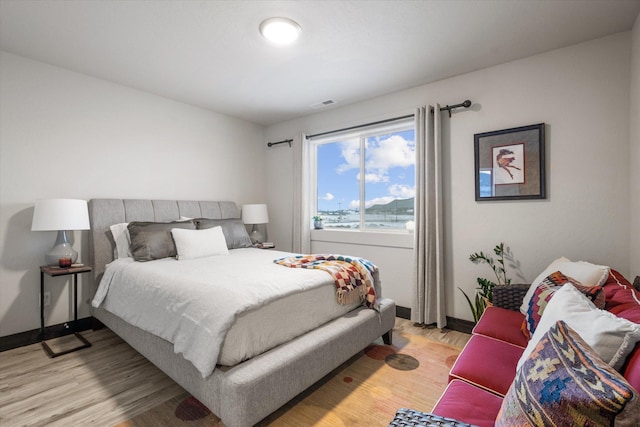 bedroom with light hardwood / wood-style floors