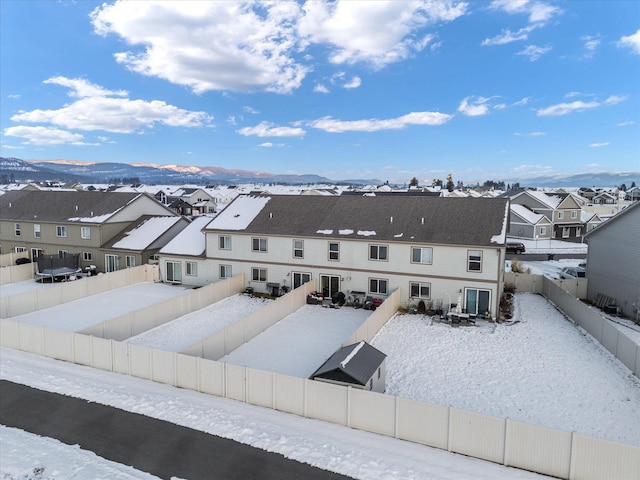 snowy aerial view with a mountain view