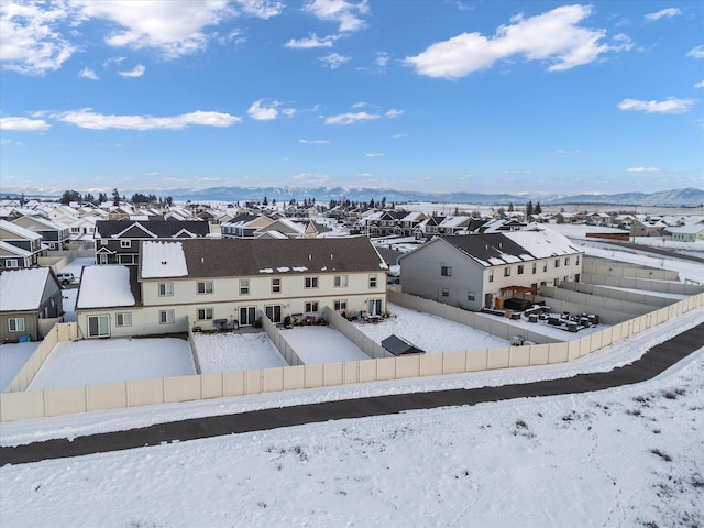 snowy aerial view featuring a mountain view