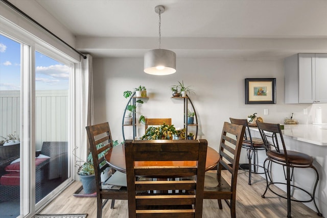 dining area featuring light wood-type flooring