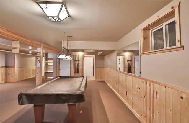 recreation room featuring dark carpet, pool table, and wooden walls