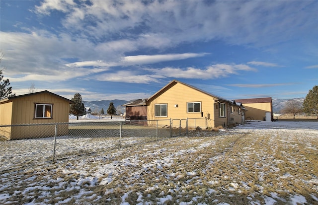 view of snowy exterior with a mountain view