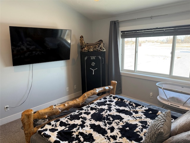 bedroom featuring lofted ceiling and carpet flooring