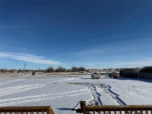 view of yard layered in snow