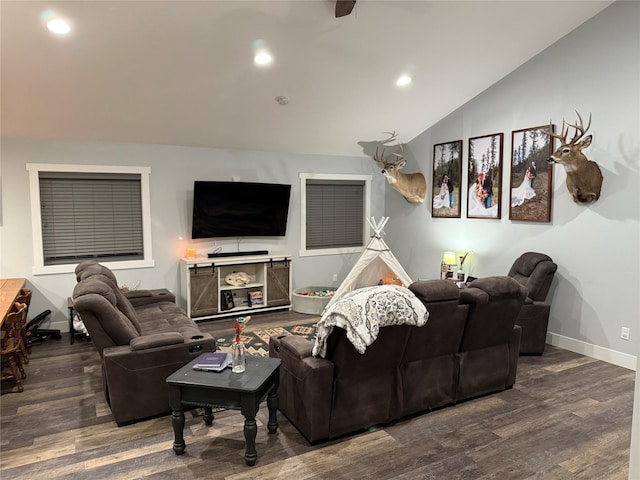 living room featuring dark hardwood / wood-style floors and vaulted ceiling