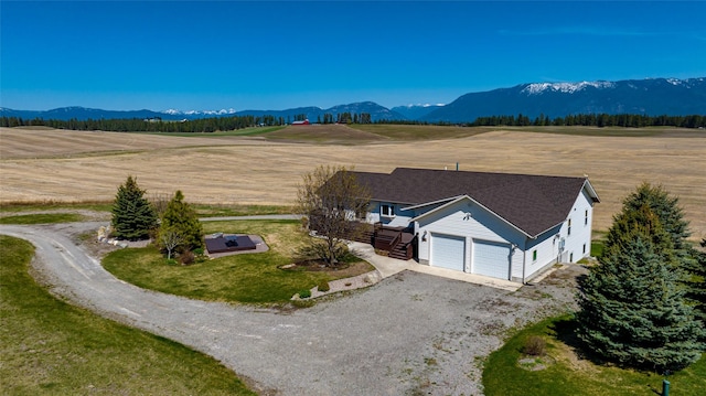 bird's eye view with a mountain view and a rural view