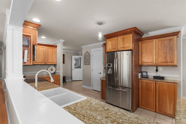 kitchen with sink, decorative light fixtures, stainless steel fridge with ice dispenser, light tile patterned floors, and ornamental molding