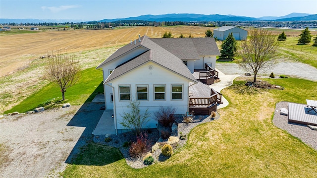 birds eye view of property with a mountain view and a rural view