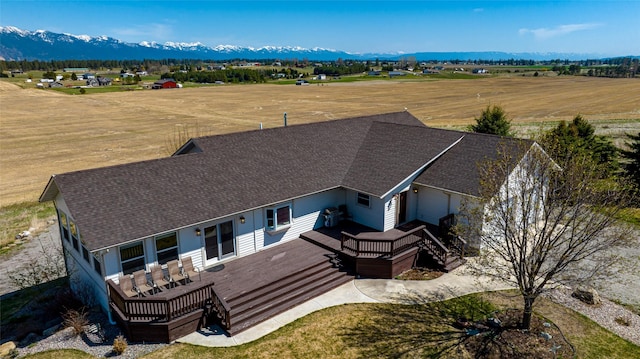 birds eye view of property featuring a mountain view and a rural view