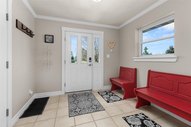 tiled foyer featuring ornamental molding