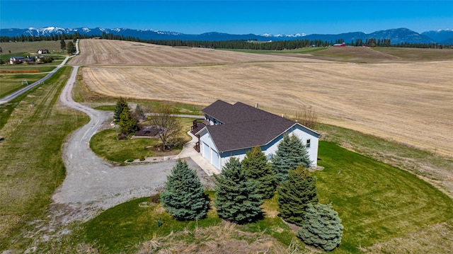 drone / aerial view with a rural view and a mountain view