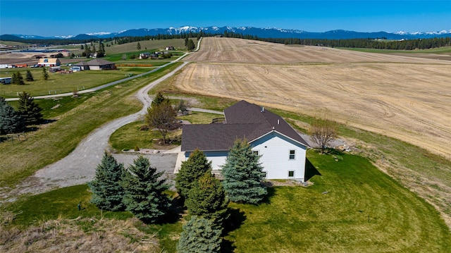 drone / aerial view with a mountain view and a rural view