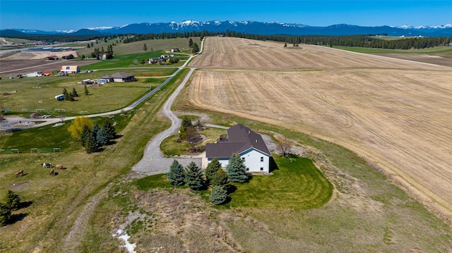 drone / aerial view featuring a mountain view and a rural view