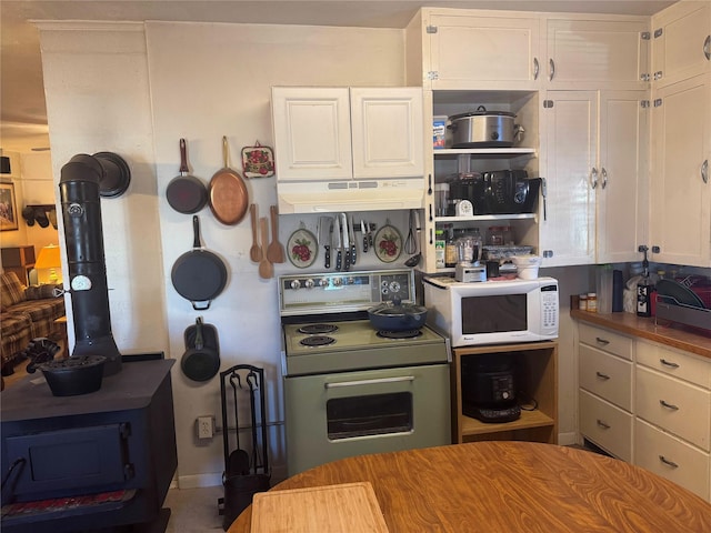 kitchen featuring white cabinets and electric stove