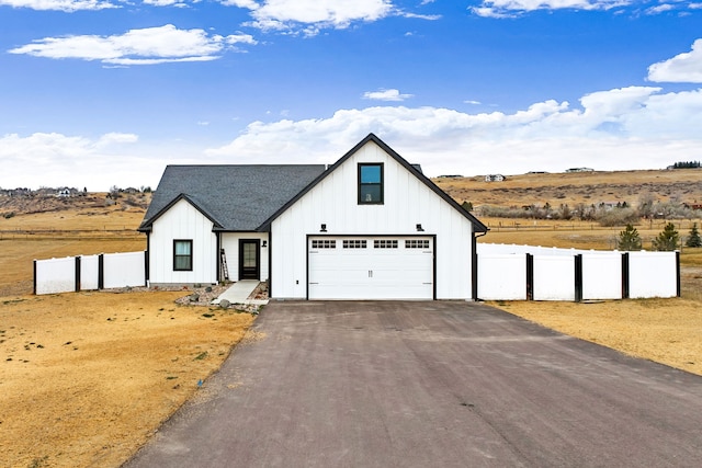 modern farmhouse style home featuring a garage