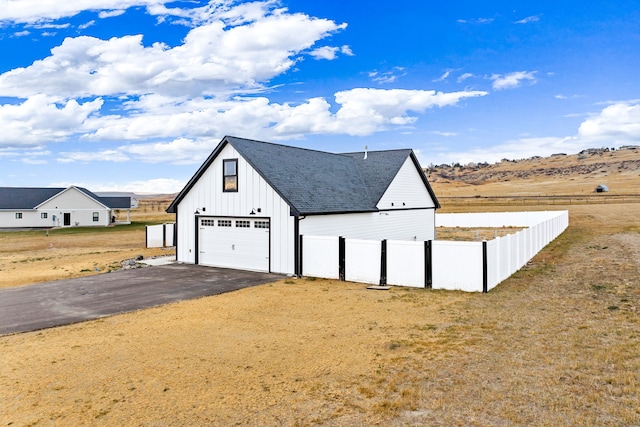 garage featuring a yard