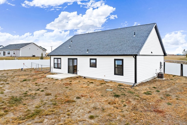 back of property with a patio and cooling unit