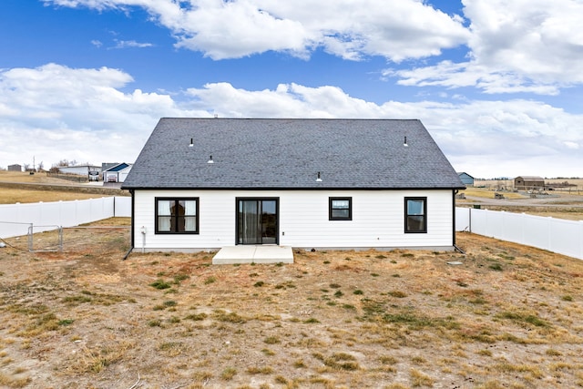 rear view of property featuring a patio area