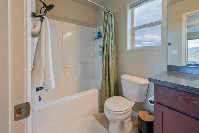 full bathroom featuring vanity, a wealth of natural light, and toilet