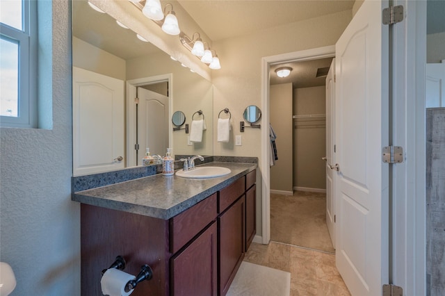 bathroom with vanity and tile patterned flooring