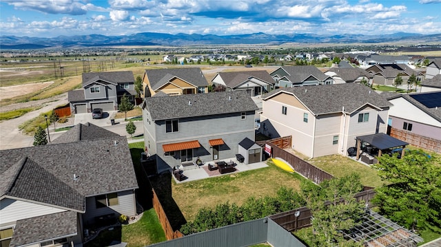 birds eye view of property featuring a mountain view