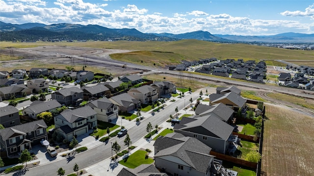 birds eye view of property with a mountain view