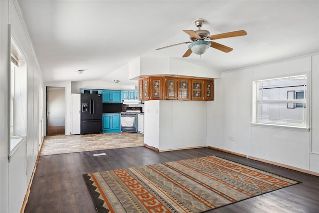 interior space featuring lofted ceiling, dark hardwood / wood-style flooring, and ceiling fan