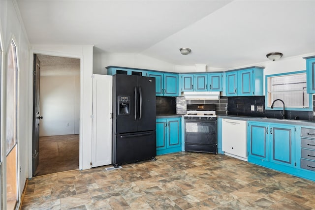 kitchen with range with gas stovetop, blue cabinets, lofted ceiling, white dishwasher, and black fridge