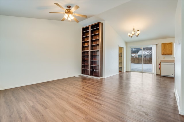 unfurnished living room with ceiling fan with notable chandelier, lofted ceiling, built in shelves, and light hardwood / wood-style floors