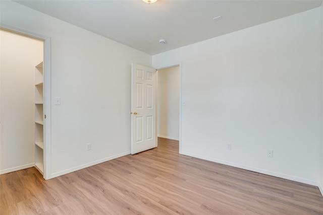 spare room with light hardwood / wood-style floors