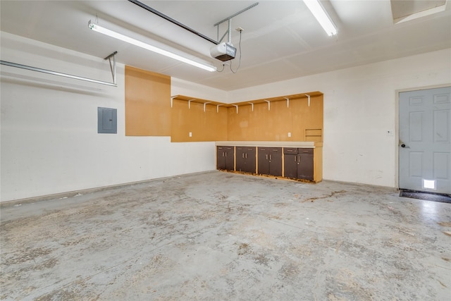 garage featuring a garage door opener and electric panel