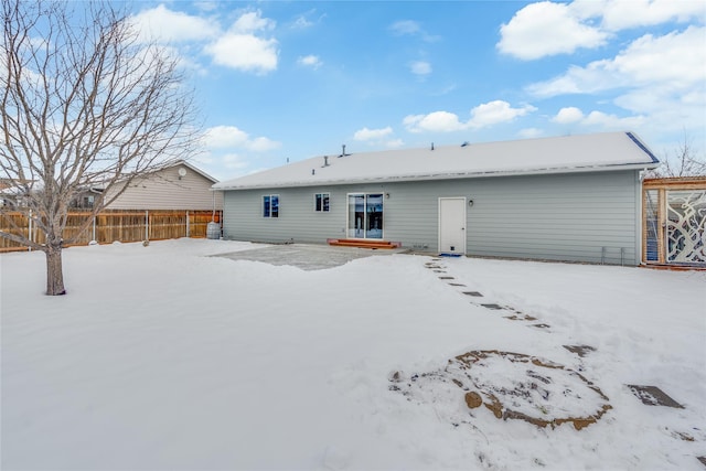 view of snow covered house