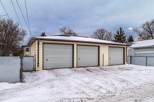 view of snow covered garage