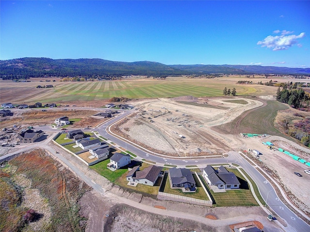 drone / aerial view with a rural view and a mountain view