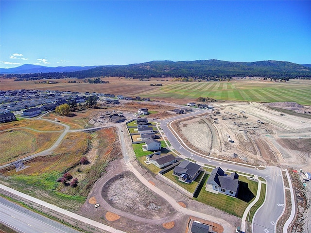 birds eye view of property with a mountain view