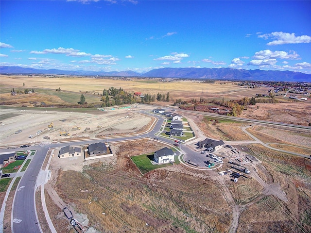 birds eye view of property with a mountain view