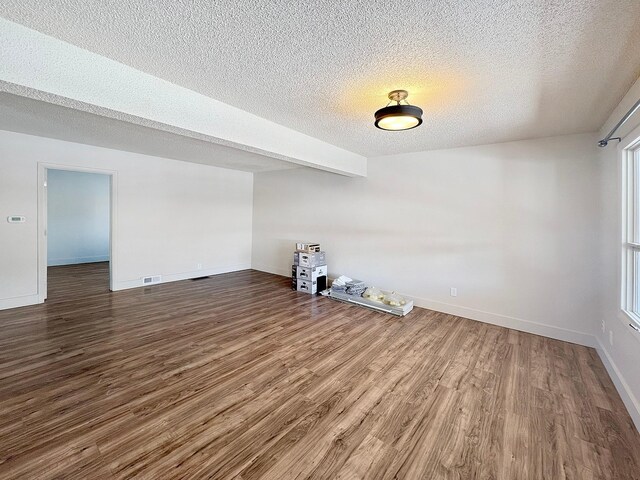 spare room featuring dark hardwood / wood-style floors