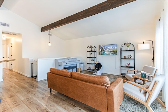 living area with vaulted ceiling with beams, light wood finished floors, baseboards, and visible vents