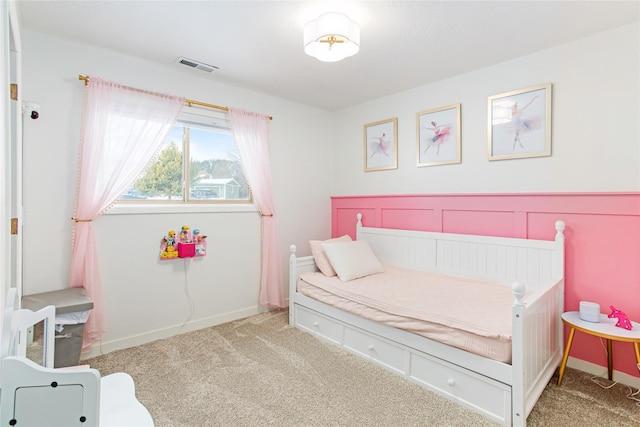 bedroom with baseboards, visible vents, and carpet flooring