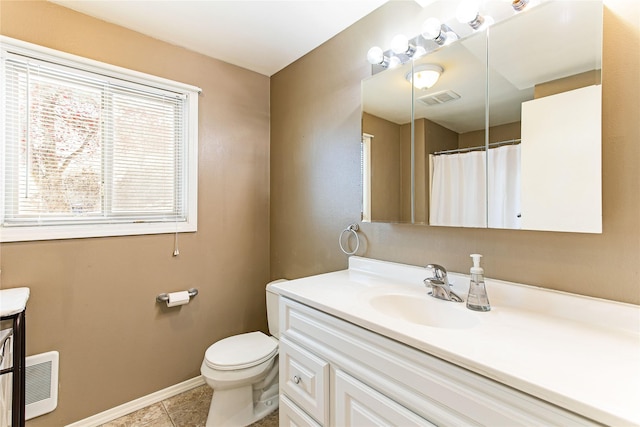 bathroom with toilet, visible vents, baseboards, and vanity