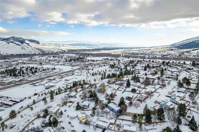 137 Cascade St, Lolo, MT 59847 - snowy aerial view featuring a mountain view